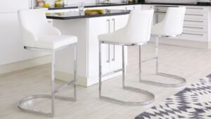 Modern Bar Stools with White Cushions and Chrome Frames in a Contemporary Kitchen